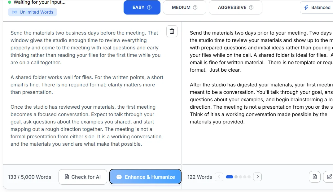 Phrasly AI Text Enhancer at Easy level in Balanced mode, with the 133-word original passage on the left and the 122-word Version 1 on the right, where "two business days" has become "two days."